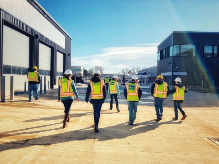 Pulse Staff Members In Yellow Construction Vests