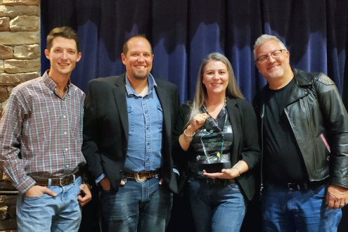 Photo of 4 Pulse employees accepting the Large Business of the Year Award at the Loveland Chamber of Commerce 2025 Annual Dinner